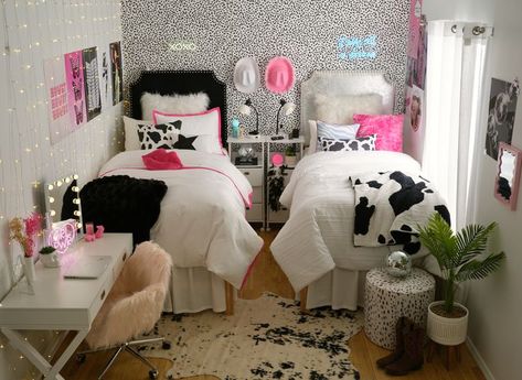 Obsessed with this disco cowgirl dorm room! Cow print + cowboy hats + pink + disco balls + neon signs + tons of organizational storage! can't wait to decorate my bedroom like this in college. dream dorm room inspo! Retro Cowgirl Room Decor, Cow Print And Pink Room, Disco Cowgirl Room Aesthetic, Disco Ball Dorm Room, Black And Pink Dorm Room, Disco Cowgirl Room Decor, Pink Cowgirl Bedroom, Cow Print Room Ideas, Disco Cowgirl Room