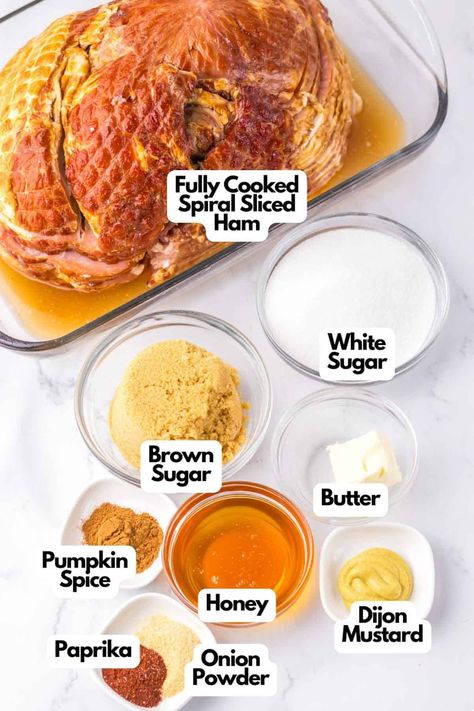 Create your own Copycat Honey Baked Ham glaze using a fully cooked spiral sliced ham, white and brown sugar, butter, pumpkin spice, honey, Dijon mustard, paprika, and onion powder for a perfect blend of sweetness and spice. Crock Pot Honey Ham, Dijon Mustard Ham Glaze, Ham Bone In Crockpot, Spiral Ham Glaze Brown Sugar Honey Baked, Brown Sugar Mustard Glaze For Ham, Ham Seasoning Recipes, Honey Brown Sugar Ham Glaze, Honey Mustard Glaze For Ham, Ham Glaze Brown Sugar Mustard