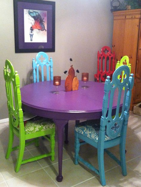 Found the gothic church chairs and table at a garage sales, $30 = 6 chairs, $25 = table. Matched paint to fabric. Cleaned, primed, painted, polyurethane. Chairs: bunting, neutral fabric, upholstery fabric, screw on and done! In the end I spent about $200 give or take. Katie Diehl. Rainbow Dining Room, Painted Table Ideas Diy, Colorful Table And Chairs, Round Table Painting Ideas Colorful, Colorful Dining Table, Painted Kitchen Table, Mexican Dining Room, Church Chairs, Gothic Kitchen