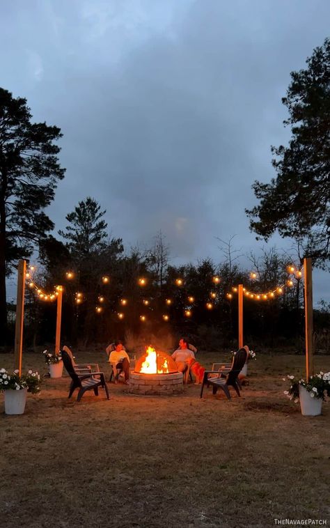 DIY String Light Posts | String light ideas | Backyard decorating ideas | Diy backyard decor | Diy outdoor lighting | How to hang string lights outside | String light planters | outdoor mood lighting | Fire pit lighting | #TheNavagePatch | TheNavagePatch.com Fire Pit Ideas With Lights, Bonfire Pit Ideas Diy, Outdoor Fire Pit Area Diy, Fire Pit Area With Lights, Outdoor Bonfire Ideas, Outdoor Fire Pit Areas Backyards, Patio Inspiration Backyard, Small Yard Fire Pit Ideas, Diy Outdoor Fire Pit Area