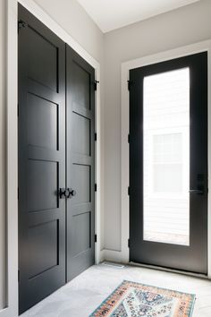 Large Entry Way Closet Ideas, Mudroom Closet Doors, Modern Farmhouse Black Interior Doors, Entrance Closet Doors, Foyer Closet Ideas, Modern Black Interior Doors, Coat Closet Door Ideas, Entrance Closet Ideas, Back Door Entry Ideas