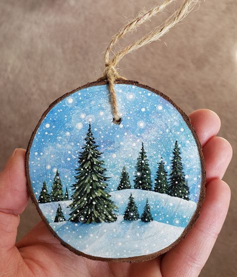 This unique wooden ornament is completely hand-painted (acrylic paint and protective sealer). I turn each wood piece into an original rustic painting, and I then attach twine as a hanger. These are great holiday gifts, stocking stuffers, and keepsakes. Size: Roughly 2.4 inches to 3 inches in diameter. The listed price is for one ornament. I started creating ornaments for fun in 2019, and it quickly turned into a fun side job! I sell my painted ornaments, along with other handmade decor, locally Painted Wooden Stocking, Holiday Painted Wood Ornaments, Hand Painted Christmas Tree Ornaments, Painted Wood Slice Christmas Ornaments, Painted Round Ornaments, Wood Painting Christmas, Painted Wood Circle Ornaments, Painted Wood Ornaments Diy, Painted Christmas Tree Ornaments