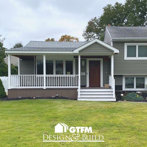 Work is finishing up on this covered front porch in Pompton Plains, New Jersey. This front porch was made using composite decking. #frontporch #porch #deck #decking #composite #compositedecking #coveredporch #roofextension #frontyard #homeimprovement #designandbuild Split Level House Front Porch, Split Level House With Front Porch, Front Porch Ideas For Split Level Homes, Split Level Front Porch Addition, Split Level Porch Ideas, Split Level With Front Porch, Adding A Front Porch To A Ranch, Split Level Front Porch, Split Level Front Porch Ideas