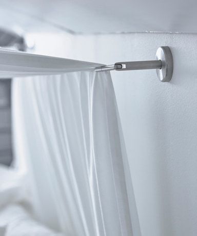 A close-up image of a curtain wire used to hang a canopy over a bed. Sloped Ceiling Bedroom, Beautiful Bed Designs, Curtain Wire, Angled Ceiling, Cosy Bed, Ceiling Curtains, Slanted Ceiling, Fall Bedding, Attic Bedroom