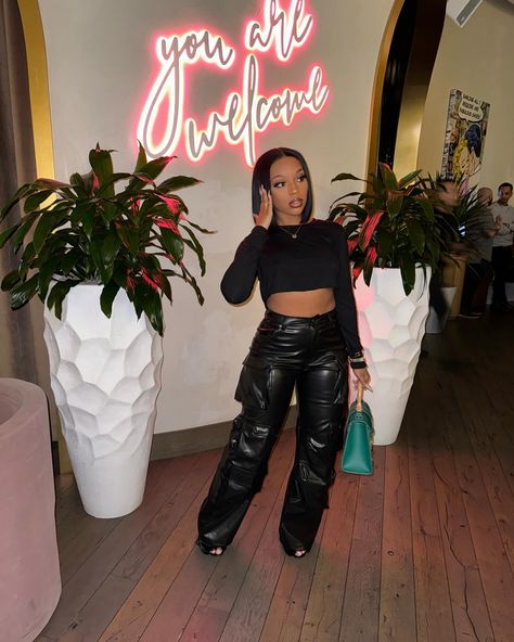 The Faux Leather Cargo Pants are a must have ♥️ 1 size large available Model wearing size small Leather Cargo Pants Outfit Black Women, Black Leather Cargo Pants Outfit, How To Style Black Cargo Pants, Leather Cargo Pants Outfit, Cargo Pants Outfit Black, Black Leather Pants Outfit, Cargo Jeans Outfit, Black Cargo Pants Outfit, Leather Cargo Pants