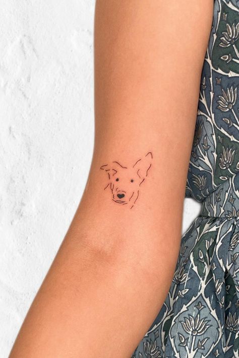 50 Dog Portrait Tattoo Ideas For Devoted Pet Lovers Small Tattoo For Dog, Dog Tattoo Men, Pet Tattoo Ideas Dogs, Dog Drawing Tattoo, Simple Pet Tattoos, Fine Line Paw Print Tattoo, Dog Tattoos Memorial, Tattoo Ideas Dog In Memory Of, Pawprint Tattoo Dog Memorial