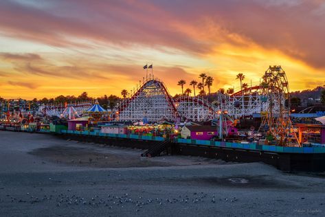 A Fiery Sunset at the Santa Cruz Boardwalk Santa cruz boardwalk Santa Cruz Boardwalk, Santa Cruz Beach Boardwalk, Cali Trip, Fiery Sunset, Santa Cruz Beach, Burbank California, Santa Cruz California, Universal Studios Hollywood, Amusement Parks