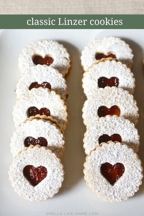 Linzer cookies with raspberry filling: The ultimate Christmas cookie! Delicate and delicious, they are major showstoppers for your holiday cookie platters and swaps! #linzercookies #linzertart #christmascookies #cookieswapcookies #linzercookieswithraspberry Soft Frosted Sugar Cookies, Linzer Cookies Recipe, Linzer Cookies, Dessert Simple, Raspberry Filling, Best Christmas Cookies, Baking Project, Fun Easy Recipes, Cut Out Cookies