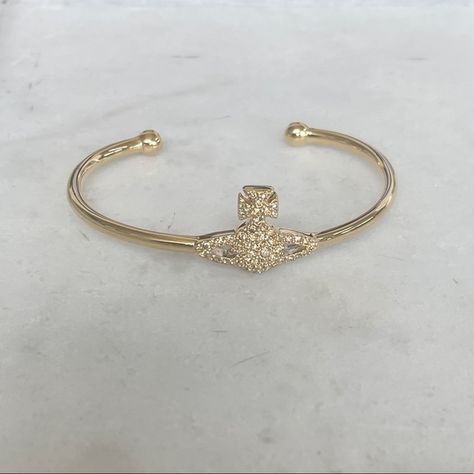 Vivienne Westwood open bangle- Gold.  Authentic Vivienne Westwood Gold Bracelet, Vivienne Westwood Ring Gold, Vivienne Westwood Gold Jewellery, Gold Vivienne Westwood, Vivienne Westwood Ring, Vivienne Westwood Bracelet, Vivienne Westwood Jewelry, Vivienne Westwood Jewellery, Bangle Gold