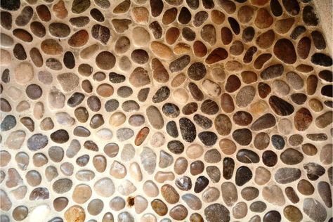 The Pros And Cons Of Pebble Shower Floors 1 Stone Shower Floor, River Rock Shower, Stone Floor Bathroom, Pebble Shower, Pebble Tile Shower, Pebble Stone Flooring, Pebble Shower Floor, Rustic Bathroom Shower, Gray Shower Tile