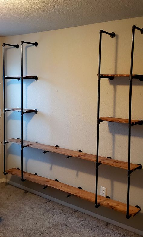 Floating Pipe Shelving Garage Man Cave Ideas On A Budget, Pipe Closet, Shelving Diy, Diy Pipe Shelves, Pipe Shelving, Built In Shelves Living Room, Clothing Store Displays, Walking Closet, Industrial Pipe Shelves