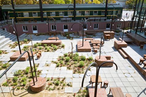 allowing the train cars to remain as the focal point of the project, the reception is contained within a tall glazed pavilion, with a new public square connecting the design. Public Garden Architecture, Landscape Architecture Graphics, Landscape And Urbanism Architecture, Plaza Design, Contemporary Garden Design, Public Space Design, Urban Landscape Design, Public Square, Areas Verdes