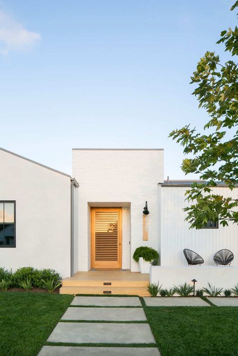 Tour a designer's family dream home with a boho vibe in Newport Beach Beige White Exterior House, Exterior House Colors Arizona, Modern White Exterior Paint Colors, White Midcentury Modern House Exterior, Modern Spanish Style Homes Exterior Paint Colors, Simply White Exterior House, Modern Stucco House Exterior, 90s Stucco Exterior Update, Cream Stucco House Exterior