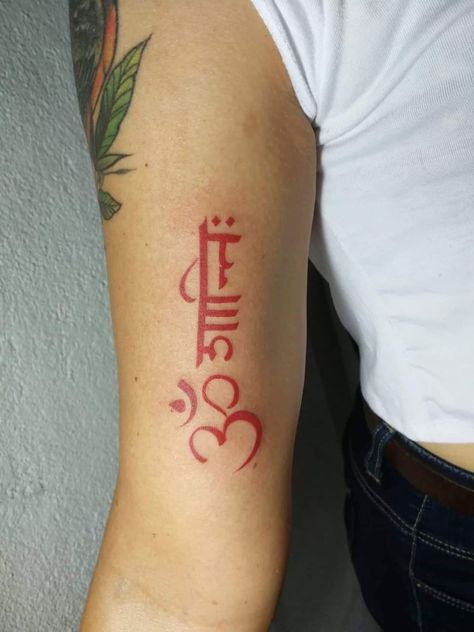 Red Ink tattoo of the buddhism symbol and the phrase “Om Mani” Red Ink Arm Tattoos, Om Shanti Tattoo, Shanti Tattoo, Red Ink Tattoos On Black People, Red Neck Tattoos, Red Ink Tattoo Ideas, Tattooing Inks, Red Ink Tattoo, Girl Neck Tattoos