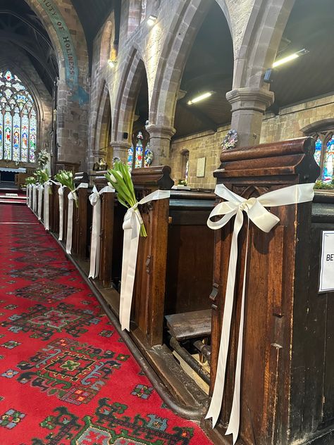 Elegant fresh white tulips and satin ribbon lined the aisle for this beautiful spring church wedding. Designed by Cheryl Louise  Venue: St James' Church, Staffordshire, UK Church Wedding Decorations Simple, Church Aisle Wedding Decor, Church Wedding Candles, Chapel Wedding Decorations, Church Aisle Decorations Wedding, Church Flowers Wedding, Church Ceremony Decorations, Church Wedding Aisle, Church Decorations Wedding