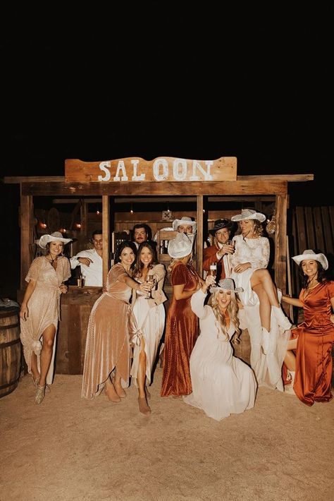 THEMED WEDDING DRESS CODES EXPLAINED 2023 Country Wedding, Beach Western Wedding, Cowboy Wedding Bridesmaids, Wild West Wedding Dress, Saloon Wedding Theme, Wedding Reception Western, Western Wedding Outdoor, Aesthetic Country Wedding, Cowboy Wedding Reception