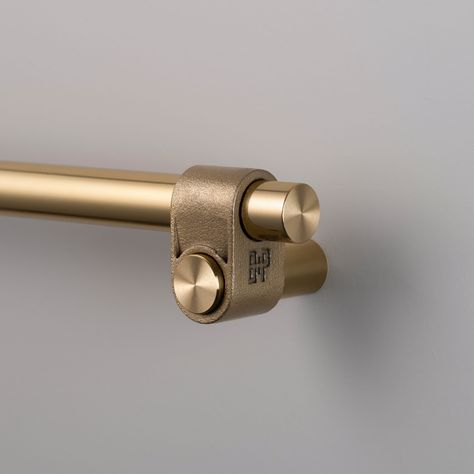 This Cast Cabinet Pull features a solid construction that is expertly finished and showcases a distinctive rough-cast knuckle and meticulously hand-polished solid metal bar. The casting process ensures each knuckle is uniquely formed, making every piece one-of-a-kind. It is suitable for a variety of interior spaces, including bathrooms. Hand tighten with a screwdriver. Power tools may strip the screws. Clean only with mild dish soap diluted in warm water. Cleaning chemicals may damage the finish Hardware Tape, Shower Door Handles, Buster Punch, Furniture Hinges, Cabinet Detailing, Brass Detail, Cabinet Latch, Pull Bar, Cookbook Holder