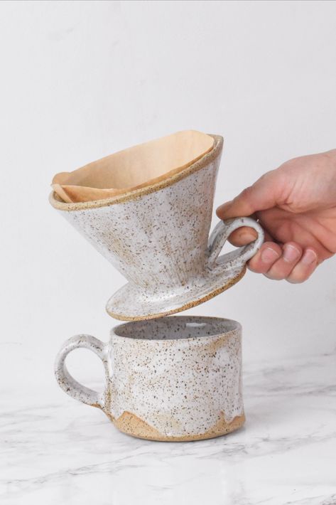 Introducing Wild Bower Studio's newest additions to our collection - the handbuilt Ceramic Pour Over and Breakfast Mug, crafted from high-quality stoneware clay in our green energy run studio in upstate NY. Our team of skilled artisans have put their heart and soul into creating these beautiful pieces, perfect for starting your day off on the right foot. The pour over allows for a smooth and delicious cup of coffee every time, while the breakfast mug Breakfast Mug, Coffee Dripper, Black Glaze, Diy Ceramic, Hand Built Pottery, Pottery Classes, Pour Over Coffee, Ceramics Projects, Ceramic Kitchen