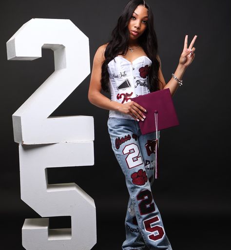 CUSTOM SKIRT SET, GRADUATION STOLE, CORSET/JEANS SET + SOCKS 🔥 Designed by @jaicreativecollection 🎀 | #RRHS🐾 🎓🤍 DM or TEXT (313)318-0114 to place an order📲 | #customseniorset #riverrougehighschool #seniorsunday #customsenioroutfit #customseniorshirts #classof2025 #classof2024 #customseniorcorset #customjeans #customcorset #RRHS #riverrougecheer #riverrougehighschool🐾 #customcorset #2025grad #2024grad #customgradstole Senior Pants Black Woman, Senior Pictures Pants, Corset Senior Pictures, Cute Senior Jeans Ideas, Senior Corset Outfit, Graduation Outfit Ideas Pants, Senior Year Pants, Graduation Pants, Prom Shirts