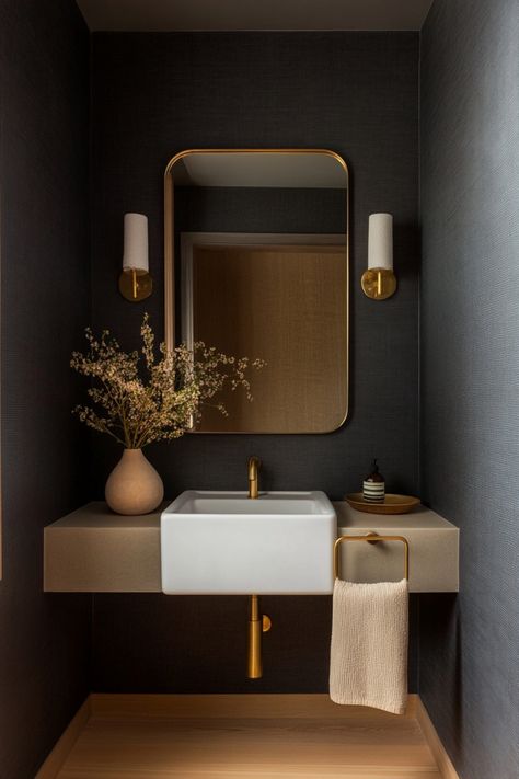 Design the perfect small moody bathroom space with these decor ideas. Dark Gray Powder Room Ideas, Moody Modern Powder Room, Mini Powder Room, Moody Neutral Bathroom, Color Drenched Powder Room, Powder Room No Window, Small Moody Bathroom Ideas, Small Bathroom Ideas Dark, Moody Half Bathroom Ideas