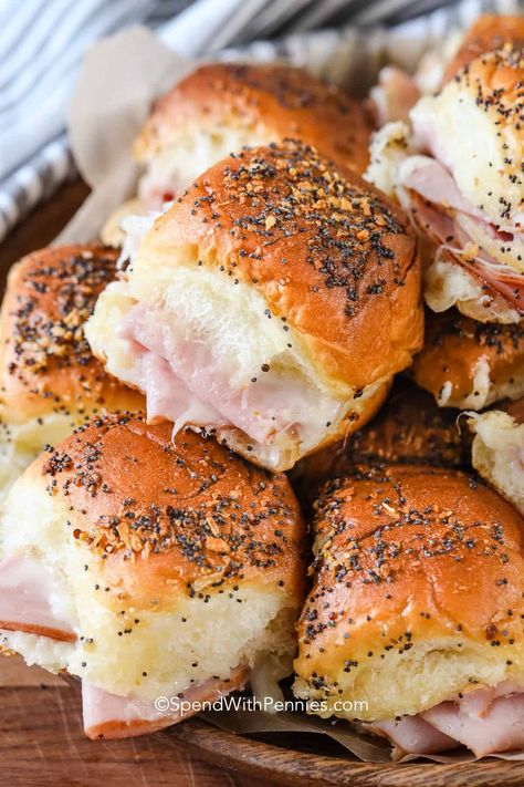 We absolutely love these hot ham and cheese sliders. They are such a great lunch or appetizer! Bake until warm and melty, then serve to a crowd for game day or a party! #hamandcheesesliders #hamandcheese #sandwiches #spendwithpennies Best Darn Ham Sandwiches You'll Ever Have, Baked Ham Sandwiches Sliders, Sheet Pan Ham And Cheese Sliders, Crescent Ham And Cheese Sandwiches, Hammie Sammies Sandwich Recipes, Mini Hot Sandwiches Parties Food, Ham And Brie Sliders, What To Serve With Sliders Parties, Hardee's Hot Ham And Cheese