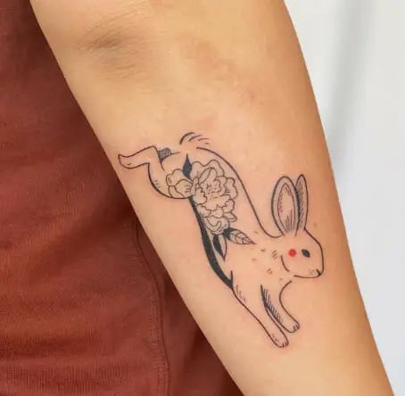 ‘Bunny’ is the common name for the rodent species known as the Rabbit. They are considered cute, intelligent, social, and loving beings. These cute rabbits are regularly touched because they represent purity, charity, and rebirth. Rabbits and the moon’s phases are connected. The rabbit foot symbolizes wealth, happiness, and luck in many cultures. These are … 51 Rabbit Tattoo Designs to Embrace Your Inner Free Spirit Read More » The post 51 Rabbit Tattoo Designs ... Chinese Zodiac Bunny Tattoo, Chinese Bunny Tattoo, Zodiac Rabbit Tattoo, Matrix Rabbit Tattoo, Celtic Rabbit Tattoo, Rabbit And Flower Tattoo, Leaping Rabbit Tattoo, Bunny Knee Tattoo, Two Rabbits Tattoo