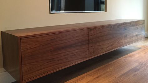 Contemporary walnut wall TV unit. This floating TV unit is handmade in Britain by AV Soul. Each piece of AV furniture is custom made. The perfect fit for every customer. Wall Tv Unit, Tv Surround, Built In Tv Wall Unit, Wall Mounted Tv Unit, Floating Tv Cabinet, Floating Tv Unit, Walnut Tv Stand, Tv Mounted, Tv Walls