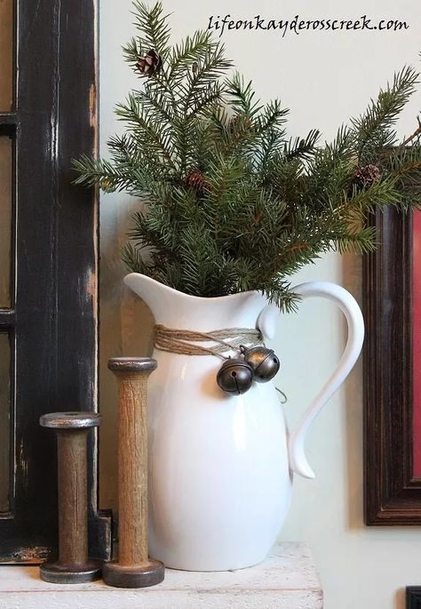 This Christmas home tour was so some much fun to do this year and inexpensive! I pulled the black, red and white color scheme from the pillow on the white chair which I made from a button down shirt. I used lot of greens, which are readily available up in our area of the North East. The tree is enormous! I carried the same black, red and white theme throughout the kitchen but kept it simple. Flea market finds and the 1-9 sign I made brighten up the counter... It's in the litt Adirondack Style, White Pitcher, Gold Color Scheme, Christmas On A Budget, Christmas Decorations Rustic, Winter Home Decor, Front Porch Christmas Decor, Farmhouse Christmas Decor, Primitive Christmas