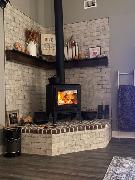 Brick Stove Fireplace, Wood Burning Stove Enclosure, Corner Stove Mantle, Wood Stove Backing, Wood Stove With Brick Surround, Corner Brick Wood Stove, Wood Stove Corner Ideas Living Room, Wood Stove Surround Corner Stone Walls, Woodstove Surrounds Corner