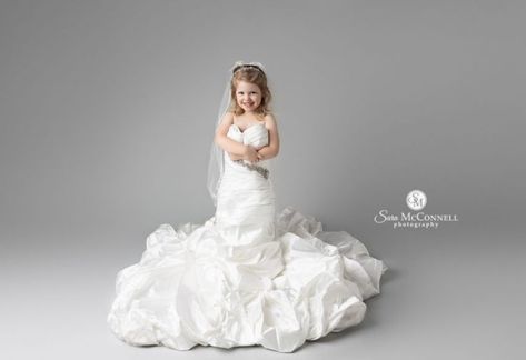 A wedding dress session is ideal for children who love to get dressed up. The dress up stage of childhood is fleeting but this session was an amazing way to hold onto it forever. This sweet little girl was very excited to be able to wear mom’s wedding gown. She was full of smiles and giggles at our session together. Miss M had clearly been looking forward to this session for awhile! Toddler Wearing Moms Wedding Dress, Moms Wedding Dress, Mom Wedding Dress, Toddler Wearing, Mom Wedding, Wedding Dress Pictures, Mom And Daughter, Wedding Dresses Photos, A Wedding Dress