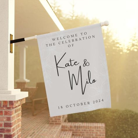 Welcome your guests in style with this elegant, personalized wedding celebration flag. Featuring a soft cream background and customizable with the names of the happy couple, this flag is a beautiful addition to any wedding venue. The delicate floral accents and sleek typography create a sophisticated and inviting look. Available in two sizes, 12" x 18" and 24.5" x 32", this weather-resistant flag is perfect for outdoor ceremonies, receptions, or as a keepsake to remember your special day. Sleek Typography, Garden House, Cream Background, Wedding Celebration, Outdoor Ceremony, Saint Louis, Happy Couple, Banners Signs, The Happy