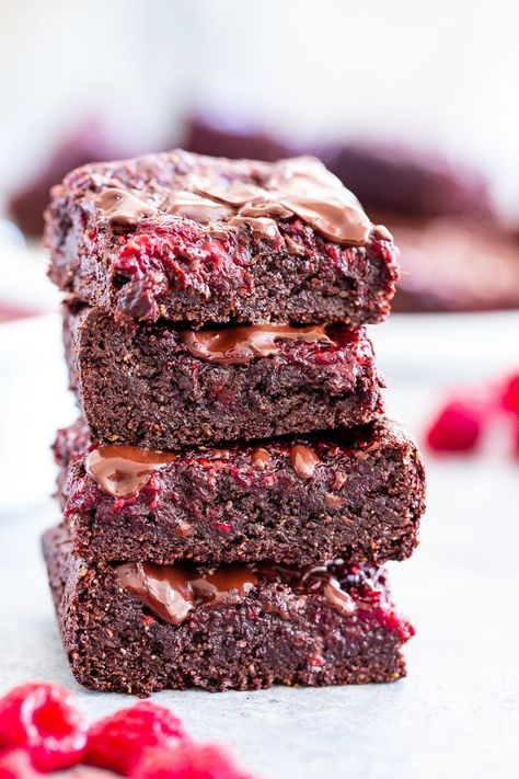 These insanely fudgy raspberry brownies are easy to whip up and just happen to be good for you!  Rich chocolate paleo and vegan brownie batter is baked with an easy raspberry sauce for the ultimate fruit and chocolate combo.  They’re gluten-free, dairy-free, and completely addicting! Raspberry Brownie, Chocolate Raspberry Brownies, Paleo Running Momma, Cookie Dough Cake, Raspberry Brownies, Double Chocolate Chip Cookies, Vegan Brownie, Raspberry Sauce, Paleo Chocolate