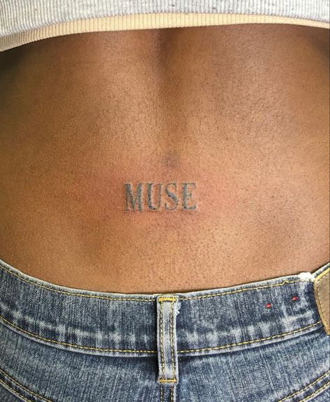 Muse Word Tattoo, Lower Back Tattoo Aesthetic, Tramp Stamps Words, Love Me Tattoo On Lower Back, Muse Tattoo Ideas, Muse Tattoo Words, Brown Tattoos On Brown Skin, Art Tattoo Women, Tattoos Brown Skin