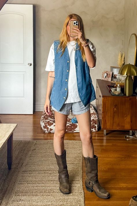 I love this easy casual outfit idea - i paired a pair of striped boxer shorts with my vintage frye harness boots, a vintage denim vest and an oversized classic white t-shirt. thrifted outfit • boxer short outfit • frye harness boots outfit • how to style boxer shorts • denim vest outfit ideas • Frye Harness Boots Outfit, How To Style Denim Vest, Denim Vest Outfit Ideas, Oversized Denim Vest Outfit, Harness Boots Outfit, Denim Vest Outfits For Women, Frye Boots Outfit, Vest Outfit Ideas, Boxer Shorts Outfit