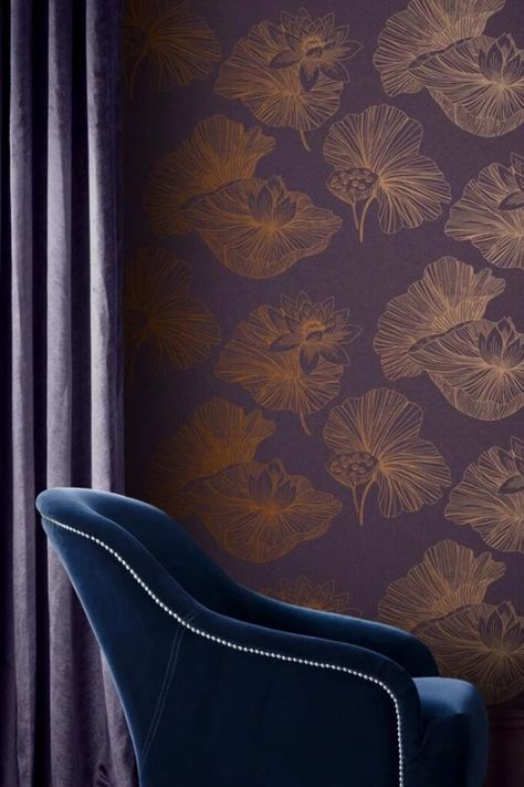 Symbolizing purity and beauty, the Lotus flower takes the main focus in this stunning wallpaper design. Rich textured purple substrate is adorned with luxurious copper metallic detailing, to give a regal, opulent feel. Combine with copper accessories and moody plum paint to create a sophisticated decor. #interiordesign #design #interior #homedecor #wallpaper #home #decor #interiors #homedesign #luxury #inspiration #renovation #housegoals #houseenvy #homeinspo  @SamanthaBlack #BlkApproved Plum Paint, Plum Wallpaper, Lotus Wallpaper, The Lotus Flower, Wallpaper Theme, Wall Material, Copper Accessories, Purple Theme, Metallic Texture