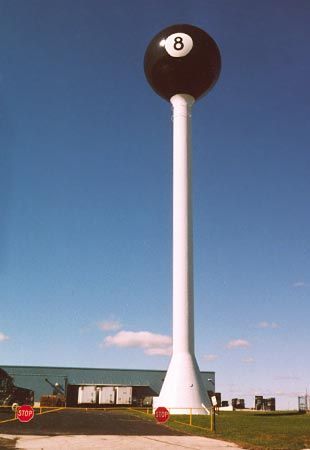 For years Tipton, Mo., was headquarters for a home-grown company that became one of the country’s largest manufacturers of pool tables. The billiards business left town in the 1980s, but this water tower decorated as the world’s largest eight ball remains. 8 Pool, Worlds Smallest, Eight Ball, Water Towers, Pool Tables, Water Tanks, Tourist Trap, Unique Buildings, Roadside Attractions