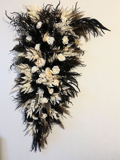 Introducing our exquisite Gothic Black Dried Flower Bouquet, a truly unique and captivating choice for your Gothic wedding. This striking bridal bouquet features a mesmerizing blend of black dried flowers, creating a dark and romantic aesthetic. Each bloom has been carefully preserved, retaining its natural beauty and delicate charm. The contrasting colors and textures of the dried flowers make this bouquet truly one-of-a-kind, adding an enchanting touch to your wedding ensemble. Displayed in an Dark Wedding Bouquet, Gothic Forest Wedding, Southern Gothic Wedding, Black Fall Wedding, Flower Archway, Black Wedding Decorations, Black Bouquet, Wedding Swag, Wedding Appetizers