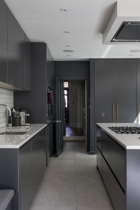 Interior Design by Imperfect Interiors at this Victorian terraced house in Balham, London. A palette of contemporary paint colours mixed with traditional period details- Farrow & Ball Strong White on the walls, dark grey kitchen cabinets, white crackle glaze tiles & brass handles make the open plan kitchen diner feel fresh and light. Photo by Chris Snook Black And Grey Kitchen, Grey Kitchen Colors, Dark Grey Kitchen Cabinets, Modern Grey Kitchen, Kitchen Grey, Open Plan Kitchen Diner, Grey Kitchen Designs, Dark Grey Kitchen, New Kitchen Cabinets