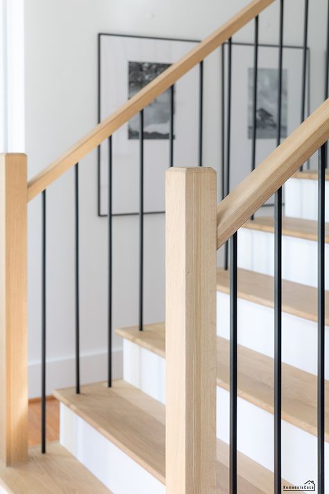 Modern staircase makeover Modern Newel Post, Handrail Design Modern, Modern Handrails For Stairs, Angled Staircase, Newel Posts For Stairs, Hardwood Stair Treads, Hardwood Floor Installation, Diy Stairs Makeover, Stair Railing Makeover