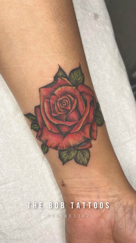 Colored Rose Tattoo | THE BOB TATTOOS | NOIDA #rose #rosetattoo #rosetattooideas #rosetattoodesign #flowertattoo #flowertattoodesigns #flowertattooideas #tattooforwomen #besttattoosforwomen #besttattooideas #handtattoo #handtattoosforwomen #forarmtattoo #armtattoo #wristtattoo #thebobtattoos Coloured Rose Tattoo, Beauty And The Beast Rose Tattoo, Single Rose Tattoos, Rose Tattoo On Arm, Cute Tattoos On Wrist, Rose Hand Tattoo, Rose Shoulder Tattoo, Rose Tattoos For Women, Small Rose Tattoo