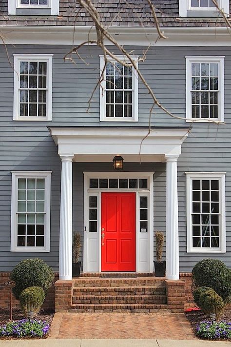 bright red door in colonial style home, pantone cherry tomato Red Door House, Colonial House Exteriors, Porch Canopy, Red Doors, Front Door Paint Colors, Colonial Exterior, Front Porch Design, Door Paint Colors, Painted Front Doors