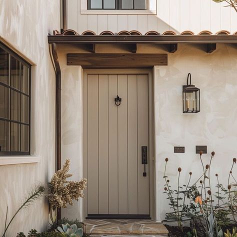 A rustic access point featuring a weathered wood portal, framed by robust columns and topped with a decorative transom window French Country Exterior, Transom Window, Column Design, Painted Front Doors, Transom Windows, Access Point, Entrance Door, Weathered Wood, Entrance Doors