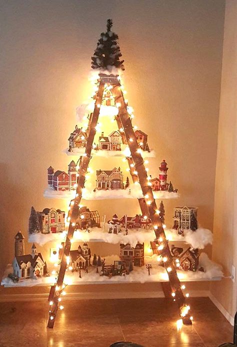 Here’s a lovely idea to do if you have an old ladder in the garage! Make a beautiful Christmas village with lights and houses! This was made by Lydia Mendoza. She says “I had an old ladder from a yard sale. I put planks of wood that I painted white on the steps to form … Ladder Christmas Tree, Christmas Ladder, Christmas Tree Village, Christmas Village Display, Diy Christmas Decorations Easy, Christmas Villages, Easy Christmas Diy, Christmas Deco, Christmas Village