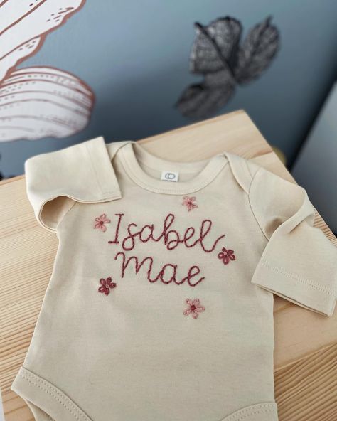 Absolutely ADORE the flower request on this newborn onesie! PLEASE always request special customizations- I’d love to make something personal for you! #newbornbodysuit #newbornonesie #custominesie #customembroidery #handembroidery Embroidered Baby Onesie, Baby Name Embroidery, Newborn Baby Onesies, Embroidered Onesie, Newborn Bodysuit, Newborn Onesies, Name Embroidery, D Love, Baby Projects