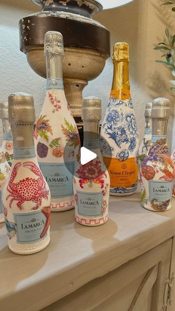 55K views · 2K likes | Kosal ~ Tredway Home Designs on Instagram: "These decorative bottles make the perfect gifts and it’s so easy to make. Whether you gift to a friend or hostess, this also could be a fun girls night activity. Here are the steps:
🍾 Wipe your bottles with cloth 
🍾  Cover your labels using painter’s tape
🍾  Paint 1st coat with chalk paint and let it dry 
🍾  Paint with more coats until you get solid coverage
🍾  After paint dries, peel off tape *
🍾  Use cocktail napkins with a design you like ***
🍾  using paintbrush and modge podge, apply your art on to your bottle
🍾  Let it dry and then spray with a sealer 
*NOTE: when peeling tape off, you will see imperfections and it’s okay. You can use a paint brush to correct some areas. If not, just decoupage some art over it Decoupage Prosecco Bottles, Painting Liquor Bottles Diy, Paper Mache Wine Bottles, Decoupage Wine Glasses, How To Decorate A Champagne Bottle, Mod Podge Champagne Bottle With Napkins, Napkin Wine Bottle Decoupage Ideas, Modge Podge Champagne Bottle Napkins, Painting Prosecco Bottles