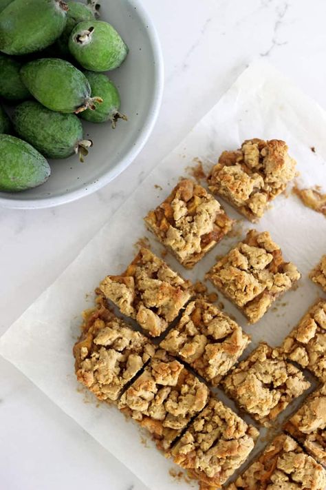 Feijoa Crumble Slice Feijoa Crumble, Fejoa Recipes, Feijoa Recipes, Coconut Macaroon Cookies, Guava Recipes, Kiwi Recipes, Easy Slice, Pineapple Guava, Warm Desserts