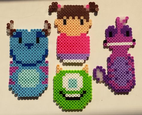 Perler bead Monsters Inc. characters by Joanne Schiavoni Monsters Inc Perler Beads, Alt Crafts, Disney Pattern, Hama Beads Disney, Hama Disney, Monsters Inc Characters, Lego Mosaic, Movie Crafts, Perler Projects