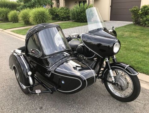 Here’s a combination of two German-made black beauties – a BMW R50/2 paired with a Steib TR500 sidecar. The TR500 was built specifically to be attached to bigger bikes like the offerings from Zundapp and BMW. It’s not as pretty as the bullet-shaped “S” models, but it was comfortable and rugged, which is why it was also used in service applications for local governments. Motorbike With Sidecar, Bike Sidecar, Motorcycle With Sidecar, Bike With Sidecar, Classic 350 Royal Enfield, Bicycle Sidecar, Three Wheel Bicycle, Ural Motorcycle, Bike Bmw