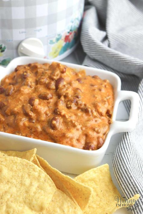 Create this easy slow cooker chili cheese dip recipe for game day or a backyard BBQ to enjoy a 4 ingredient appetizer everyone will love. Chili Cheese Dip Crockpot Velveeta, Velveeta Chili Dip, Slow Cooker Chili Cheese Dip, Gluten Free Chili Seasoning, Velveeta Chili Cheese Dip, Hormel Chili Cheese Dip Velveeta, Chili Cheese Dip Crockpot, Chili Bean Dip, Chili’s Cheese Dip Recipe