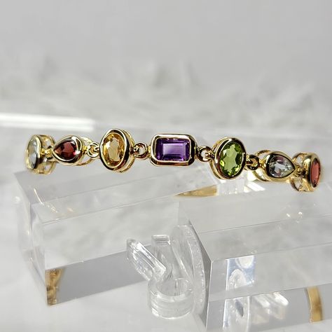 Gorgeous Yellow Gold Over Sterling Silver, Oval Hinged Bracelet With Approximately 6-7 Carats Of Beautiful Clear, Topaz, Garnet, Citrine, And Amethyst Channel- Gallery Set. The Hinge Opens For Ease Of Putting On And Removing And Has A Double Security Latch. The Diameter Is Approximately 2.5 Inches. Thanks For Shopping My Closet! Gemstone Bangle Bracelets, Purple Beaded Bracelets, Multi Gemstone Bracelet, Expandable Bangle Bracelet, Rose Gold Bangle, Jewelry Bracelets Gold, Gems Bracelet, Gemstone Bangle, Gold Charm Bracelet